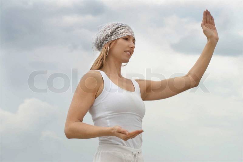Tai chi is a form of moving meditation by doing sequences of movements with slow soft and graceful transitions between them, stock photo