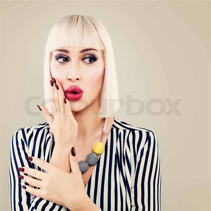 Fashion Portrait of Shocking Surprised Woman. Glamour Model with Makeup, Manicure, Blonde Hair , stock photo