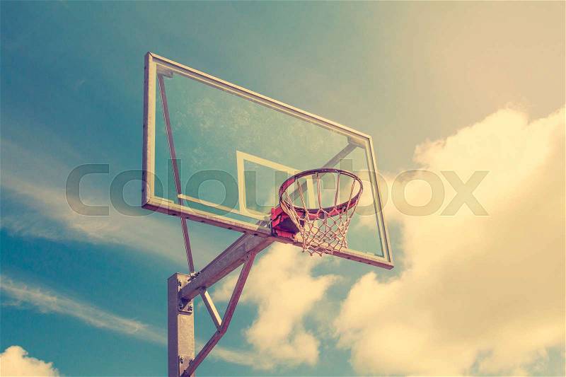 Basketball hoop against a evening sky background, stock photo