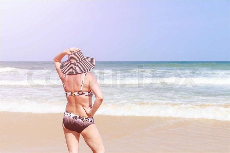 Caucasian woman or tourist from europe with happy and relax time on the tropical beach at Karon, Phuket province southern of Thailand, stock photo