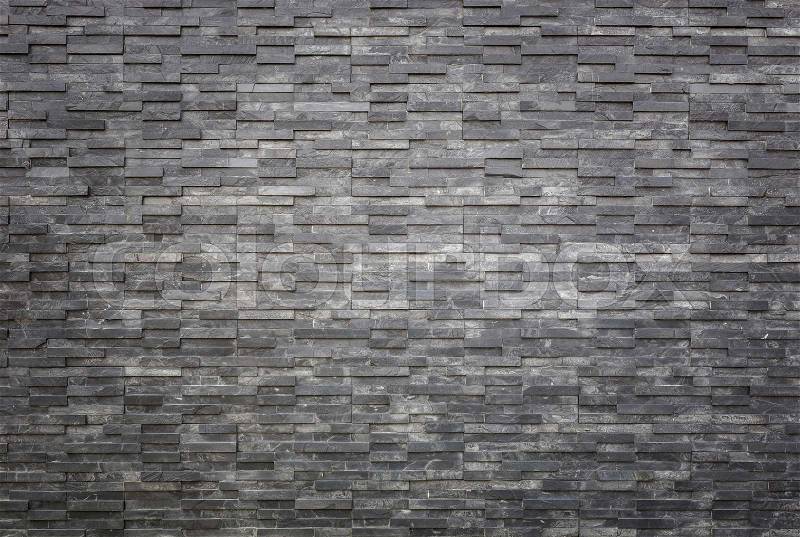 Pattern of black slate wall texture and background. Interior or exterior decoration, stock photo