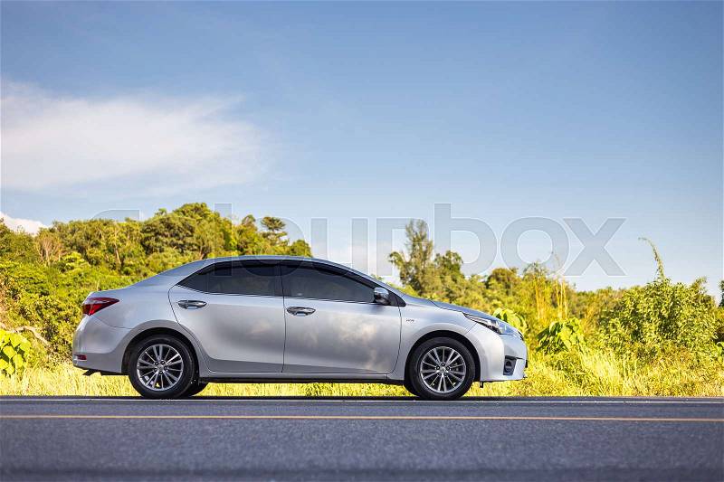 PHUKET, THAILAND - JUNE 16 : Toyota Corolla Altis parking on the asphalt road in Phuket on June 16, 2017. The official dealer of Toyota, who is the top market share for commercial car, stock photo