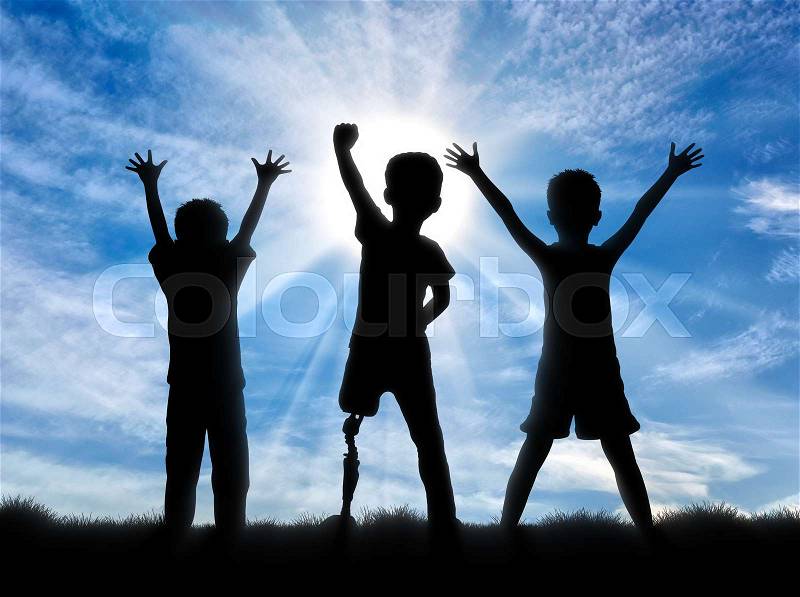 Children with disabilities in society concept. Happy disabled boy with a prosthetic leg standing among his friends, on sky background, stock photo