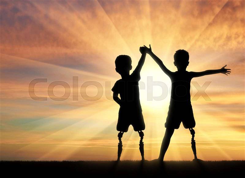 Children with disabilities. Two boys of a disabled person with a prosthetic leg standing, holding hands on sunset background, stock photo