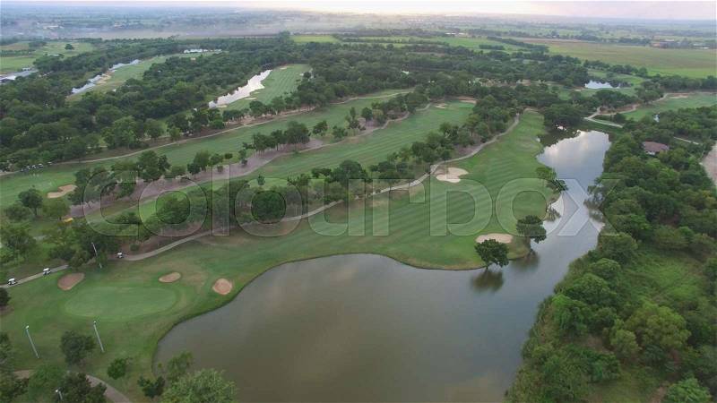 Aerial view of tree lined Golf Course, stock photo