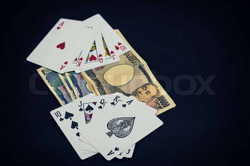 Abstract scene of poker card play on japan money with vintage filter - can use to display or montage on product, stock photo