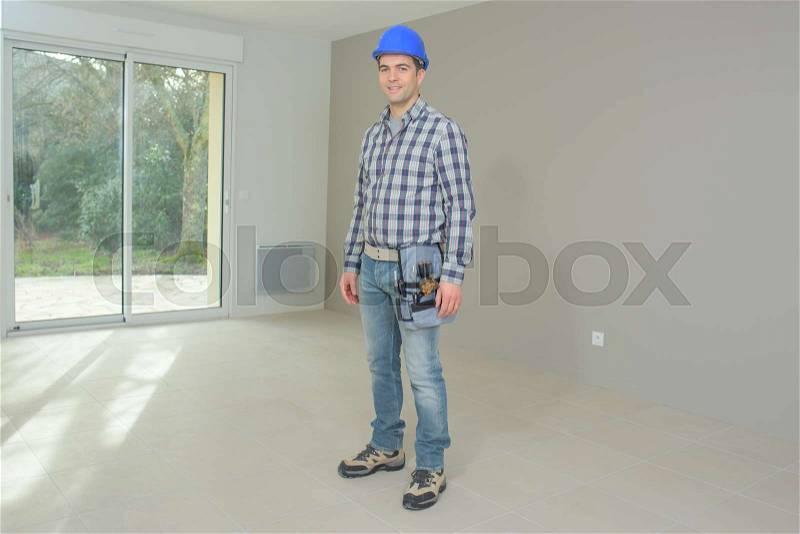 Builder happy to have finished the job, stock photo