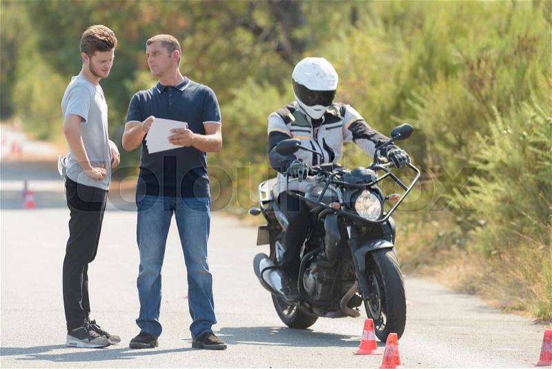 Young man begginner riding skill training motordrom, stock photo