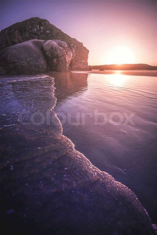Sunset on the deserted beach, stock photo