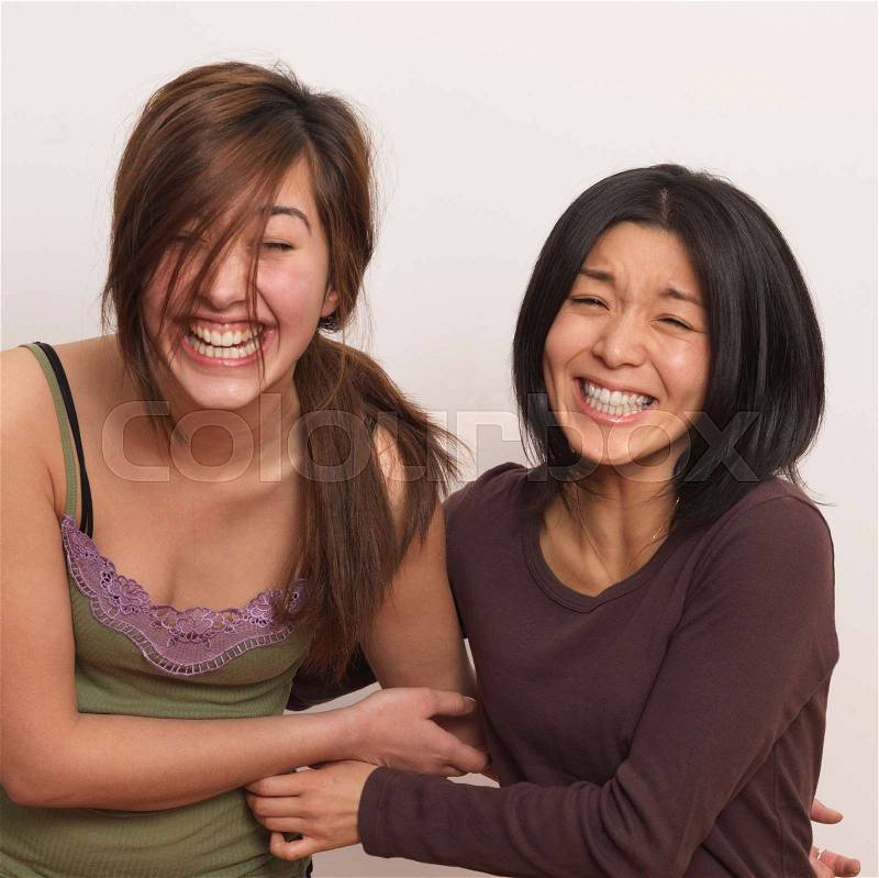 Two women laughing, stock photo