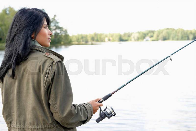Woman fishing, stock photo