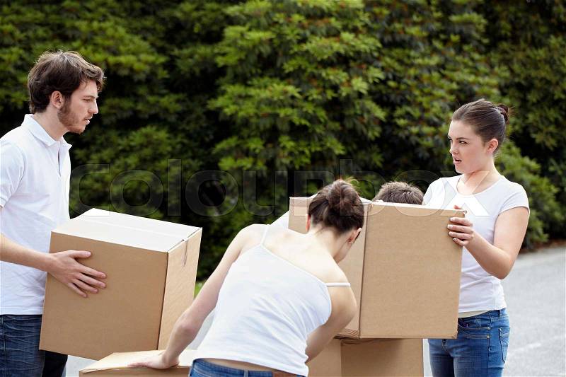 People stacking cardboard boxes, stock photo