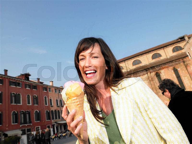 Woman eating ice cream. Venice Italy, stock photo