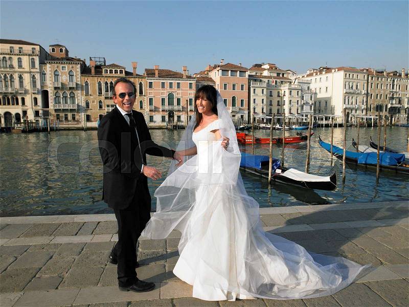 Bride and groom laughing. Grand Canal, stock photo
