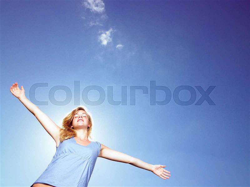 Girl with arms wide open, stock photo
