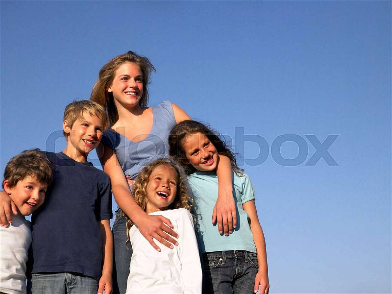 Group of kids looking at the horizon, stock photo