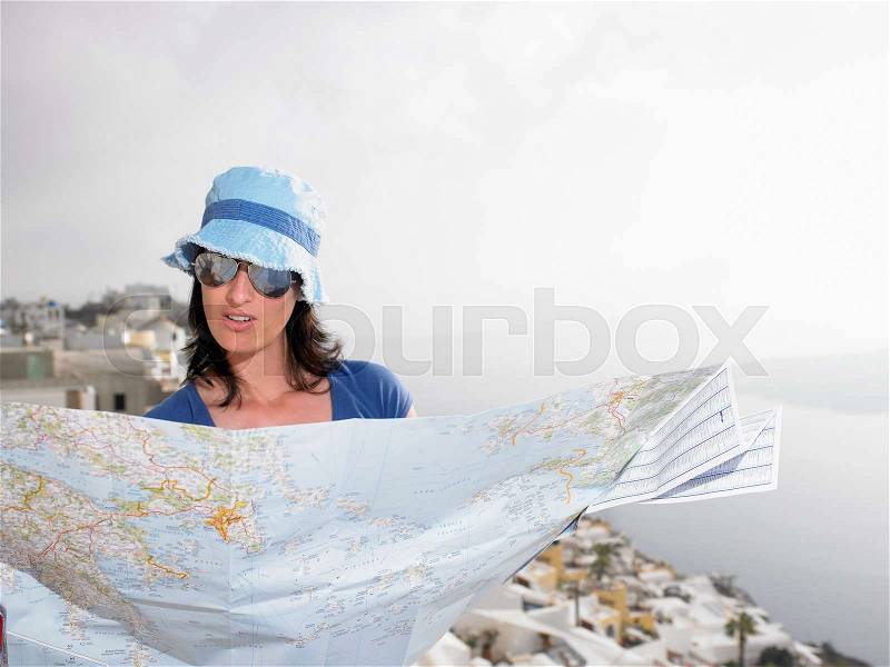 Woman looking at a map, stock photo