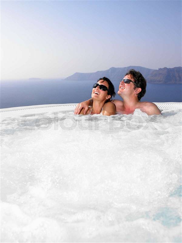 Couple in hot tub, stock photo