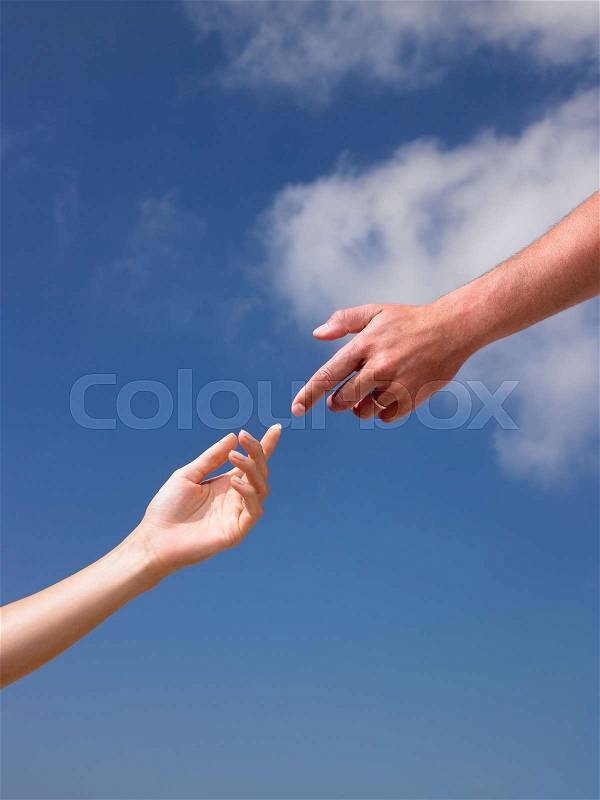 Two hands, almost touching each other, stock photo
