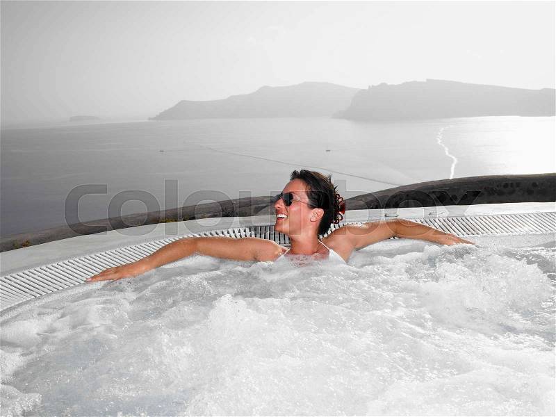 Woman in hot tub, stock photo