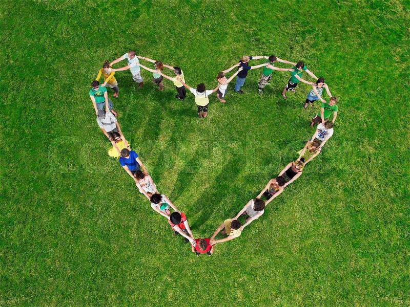 Group in heart shape formation, stock photo