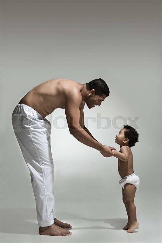Father and son holding hands, stock photo