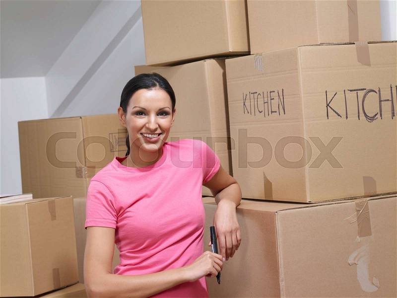 Portrait of a woman moving house, stock photo