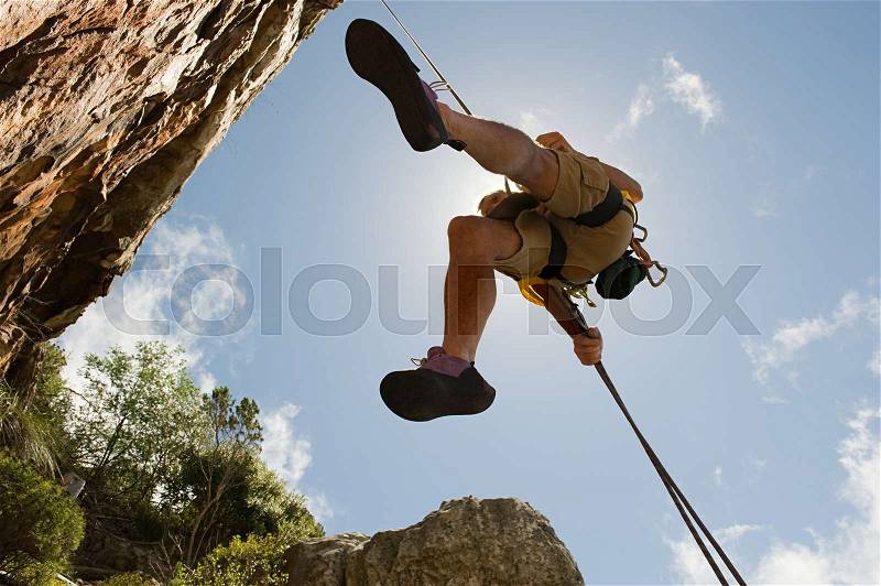 Man abseiling, stock photo