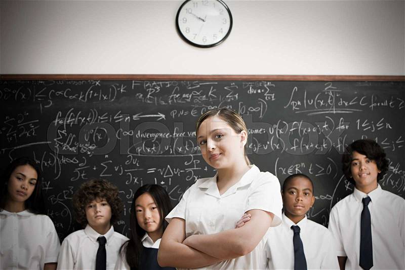 Students in front of blackboard, stock photo