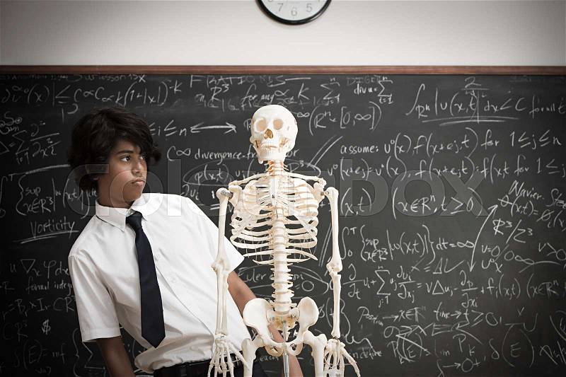 Boy with skeleton, stock photo