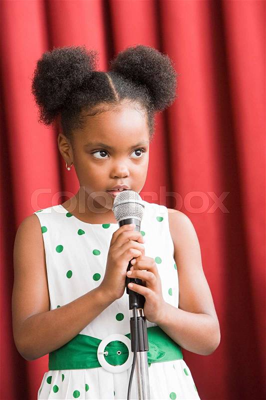 Girl with microphone, stock photo