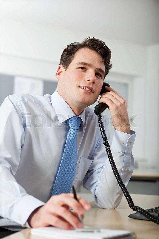 Office worker on telephone call, stock photo