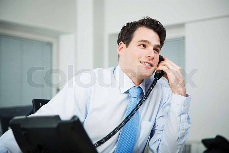 Office worker on telephone call, stock photo