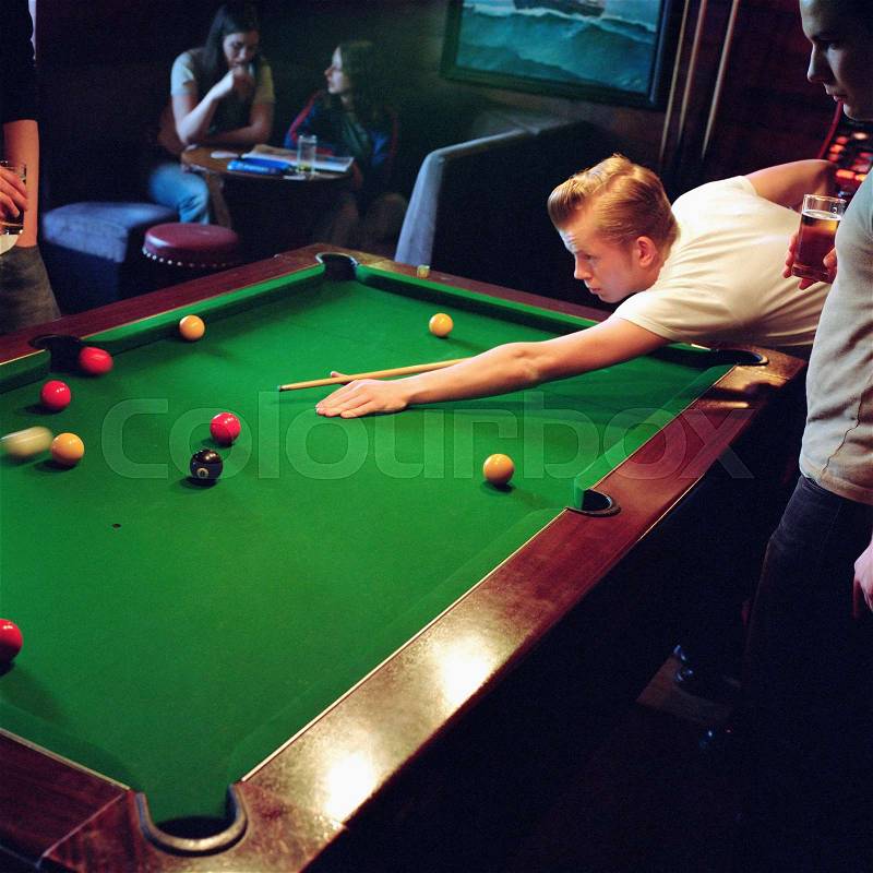 Men playing pool, stock photo