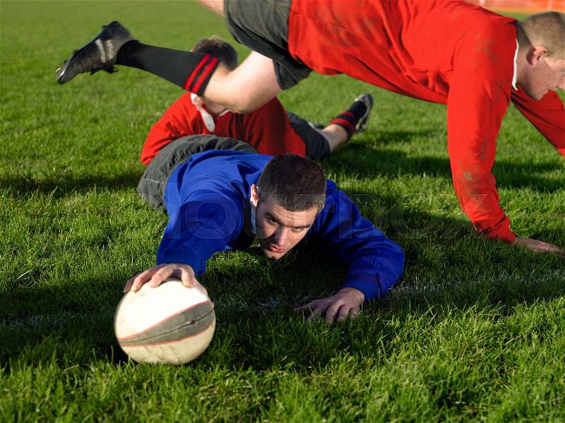 Rugby player scoring a try, stock photo