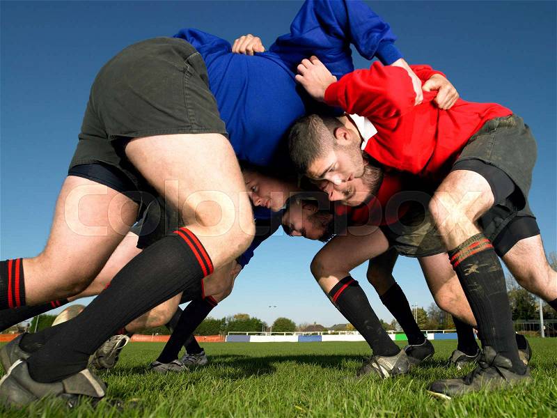 Rugby players in a scrum, stock photo