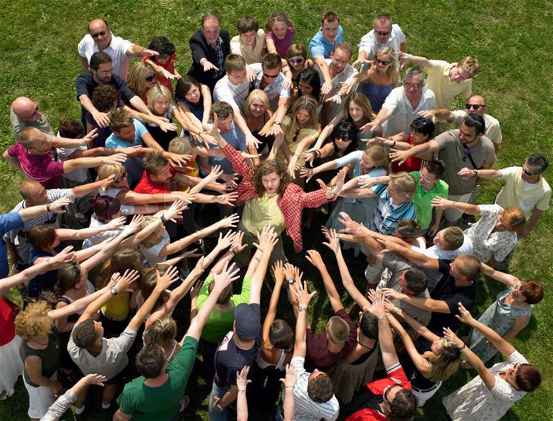 Man in the middle of a crowd, stock photo