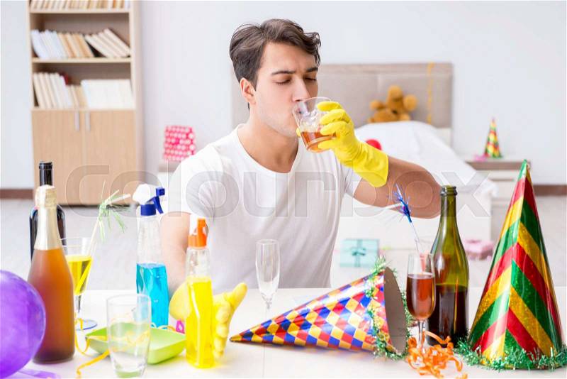 Young man after the wild Christmas party, stock photo