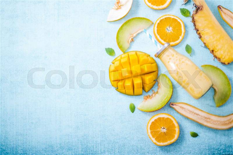 Tropical smoothie border background, flat lay, stock photo