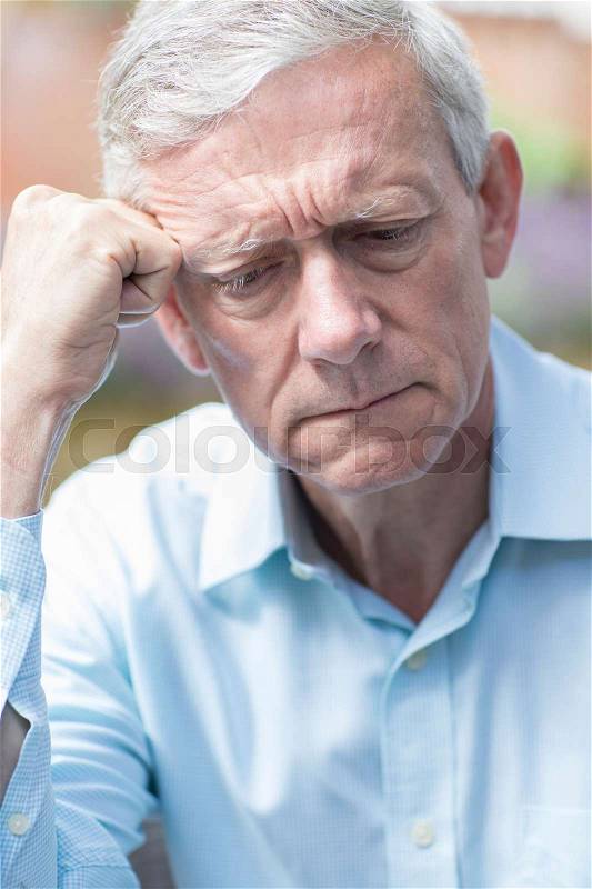 Head And Shoulders Shot Of Worried Senior Man, stock photo