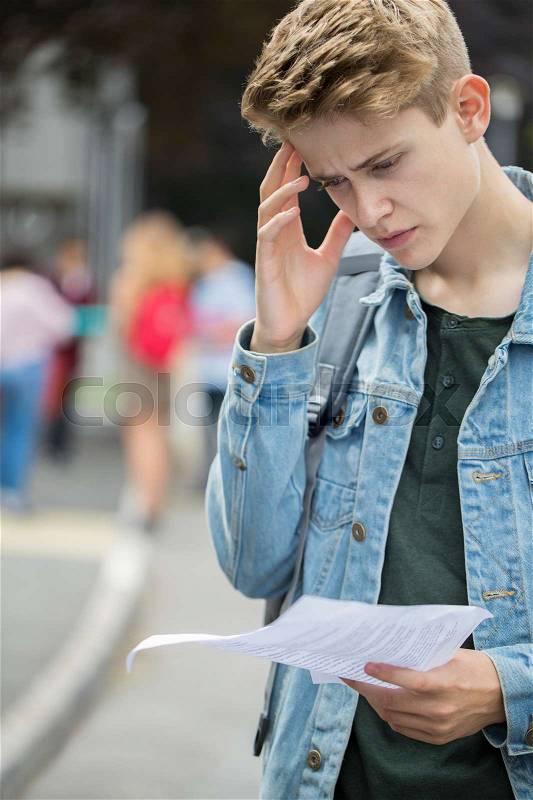 Teenage Boy Disappointed With Exam Results, stock photo