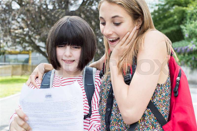 Teenage Girls Celebrating Good Exam Result, stock photo