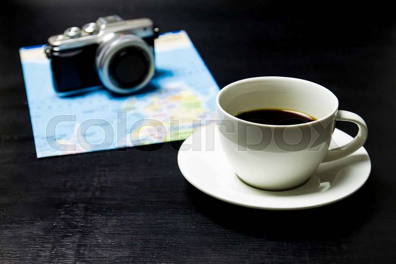 Coffee with camera and world map on wood background, stock photo