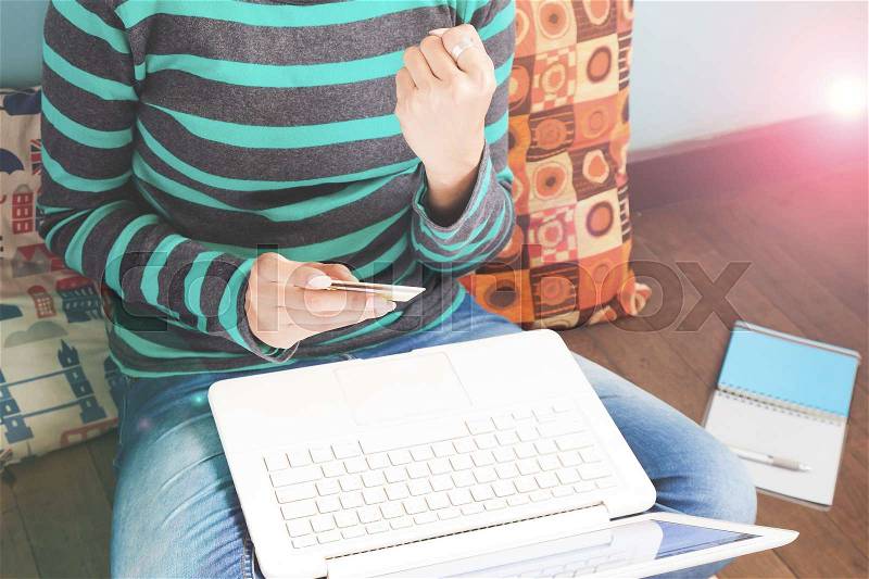 Technology, shopping, banking, home and lifestyle concept - close up of female with laptop computer at home, stock photo