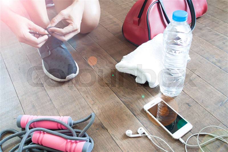 Sport fitness concept with female and sport equipments, mobile device and water, Healthy lifestyle, stock photo