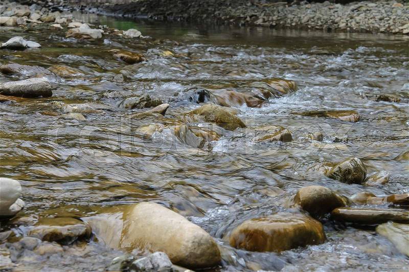Large rocks in river water. Carpathians, Ukraine, stock photo