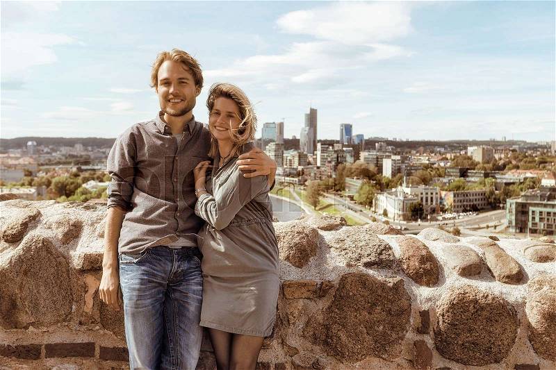 Young caucasian couple in front of city skyline. Romantic concept , stock photo