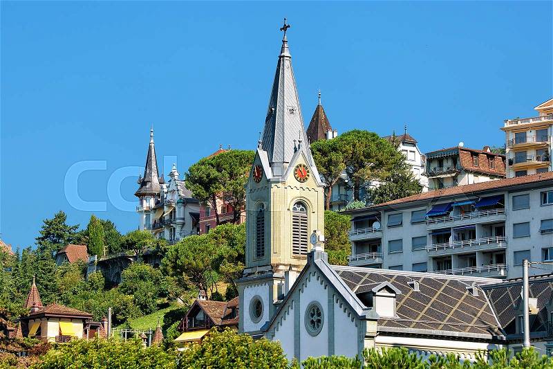 Church clock tower at Geneva Lake in Montreux, Swiss Riviera, stock photo