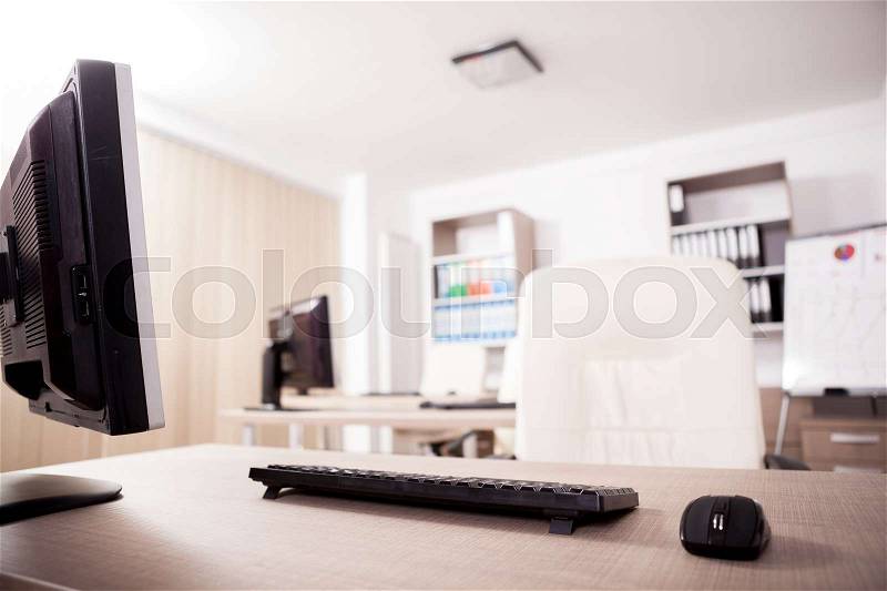 Close up on mouse and keyboard in modern empty office. Workplace and concept, stock photo
