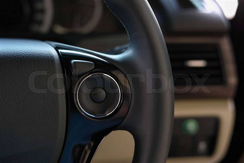 Control panel blank button press on steering wheel for car driver, stock photo